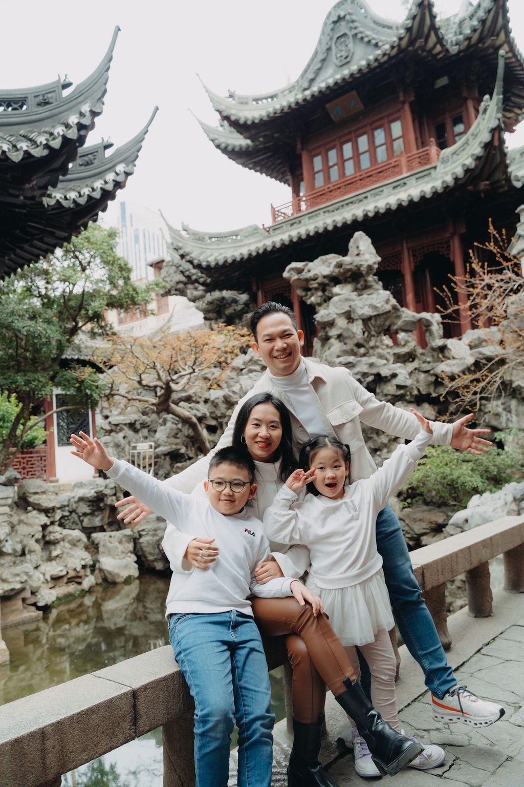 Family portrait in a classical Suzhou garden, where tradition meets everyday joy.